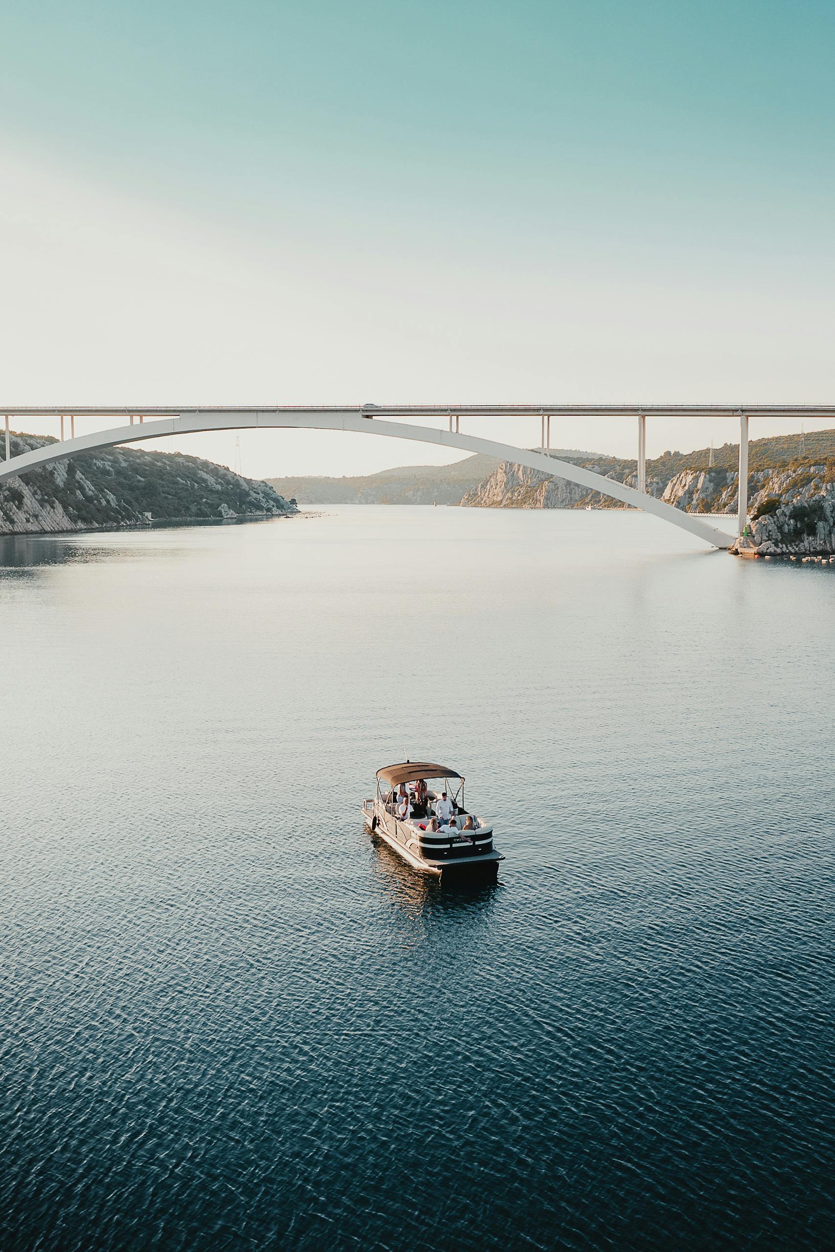 Boat Sailing Towards the Krka Bridge