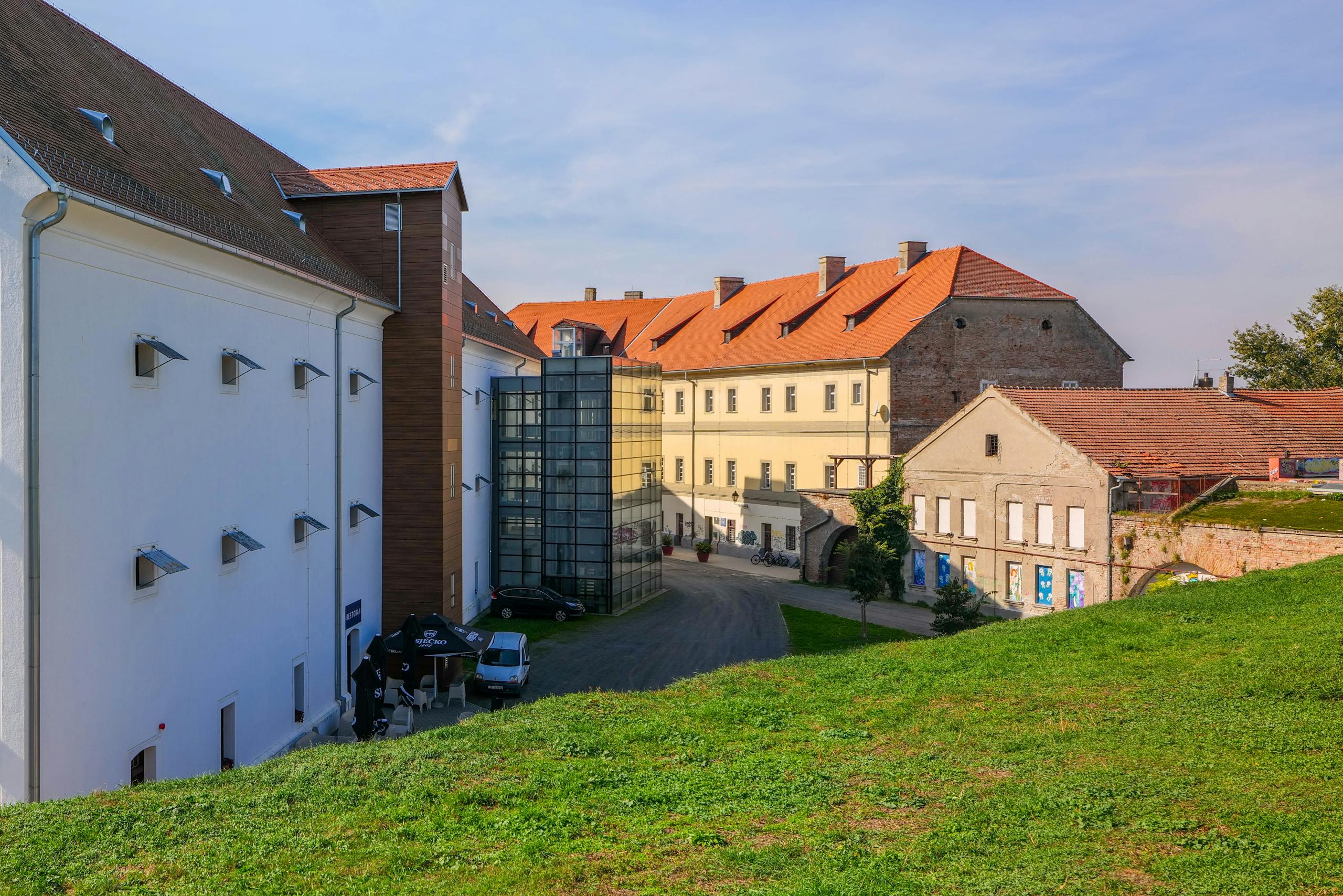 Scenic view of historic buildings in Osijek, Croatia featuring vibrant architecture.